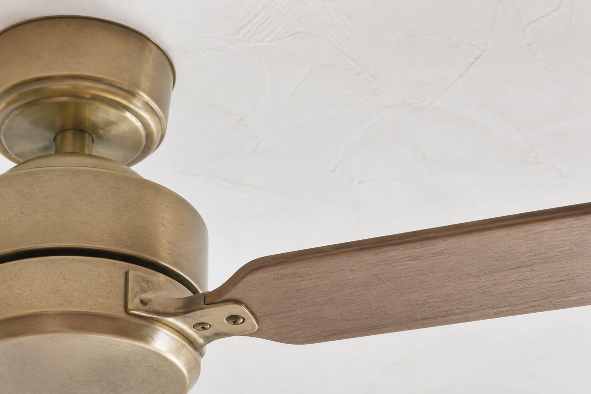 Ceiling fan blade and brass housing detail